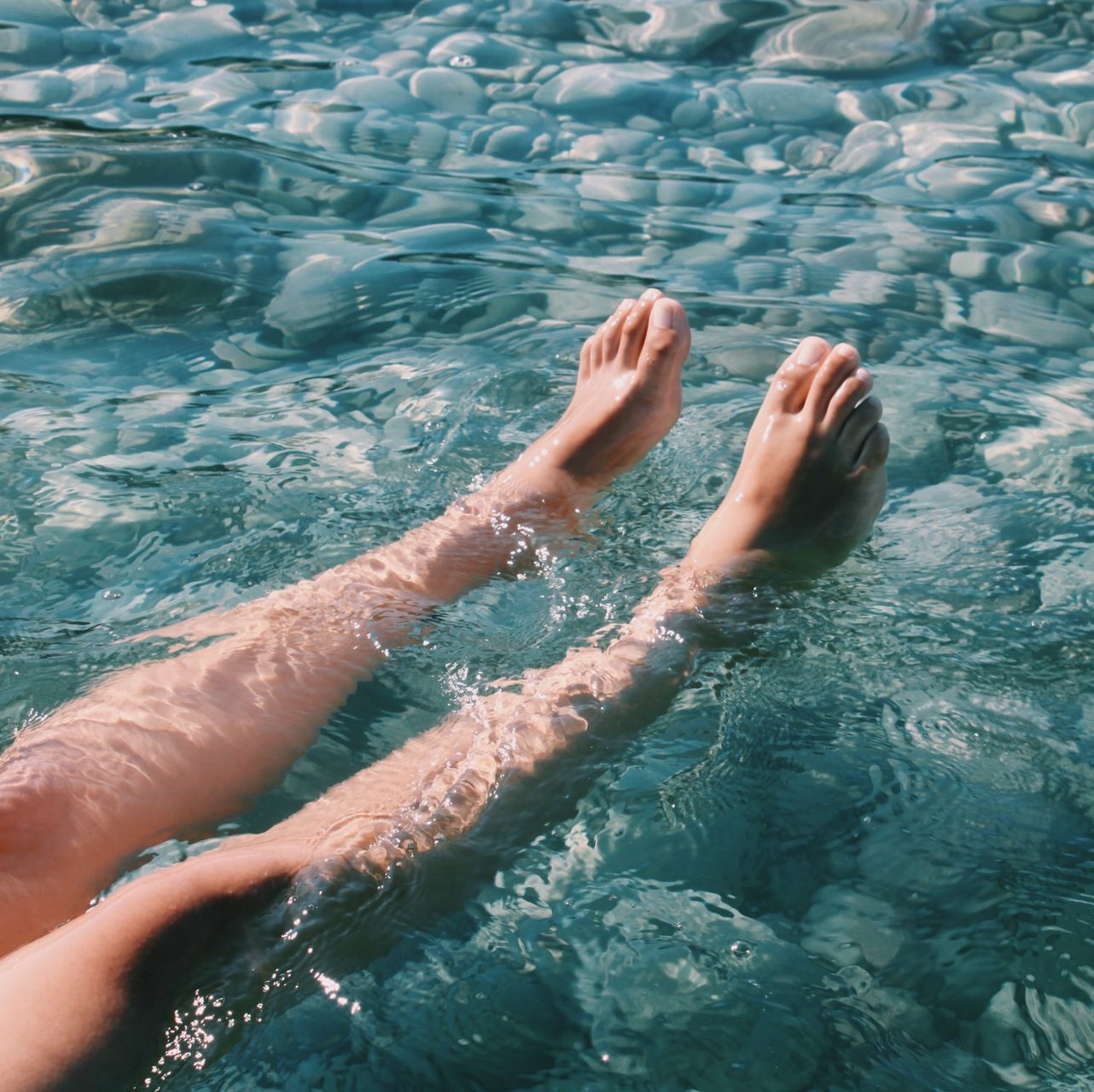 persons feet on water