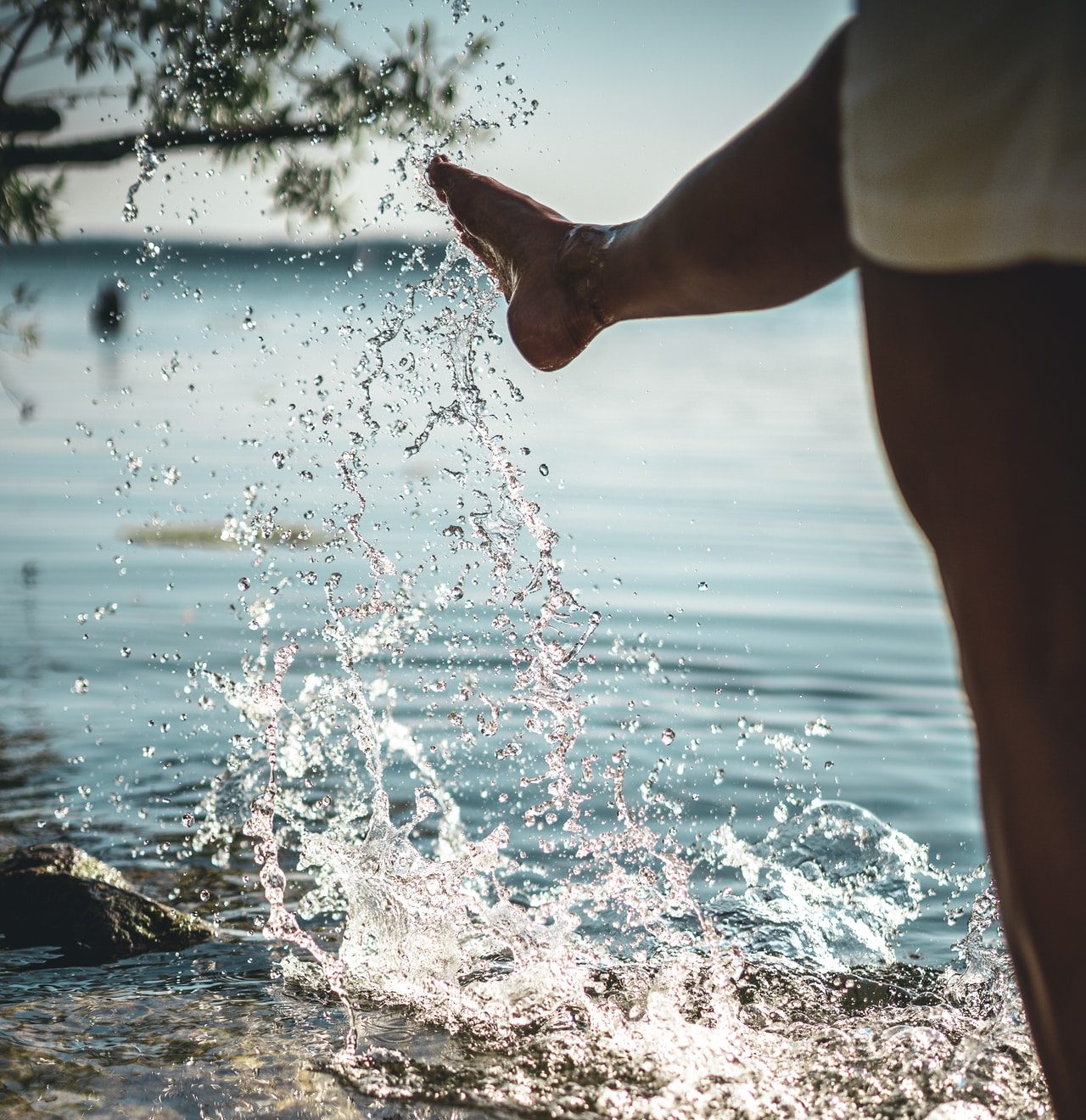 person standing on water during daytime